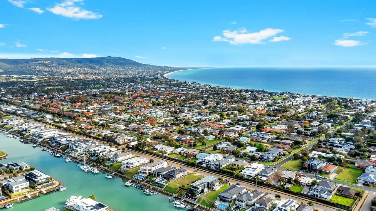 Aerial view of a Melbourne suburb showcasing houses for sale, highlighting the residential layout and green spaces.